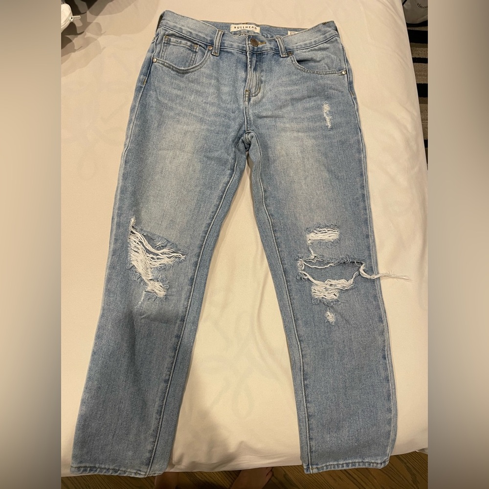 Mid-rise lightwash distressed denim, skinnies.